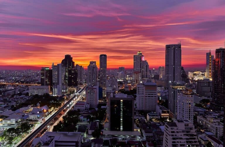 a view of a city at sunset from the top of a building in Bangkok