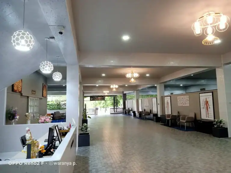 Modern medical clinic reception area in Bangkok, featuring seating, decor, and patient check-in desks - Treatment room Sanpudard Wellness Club
