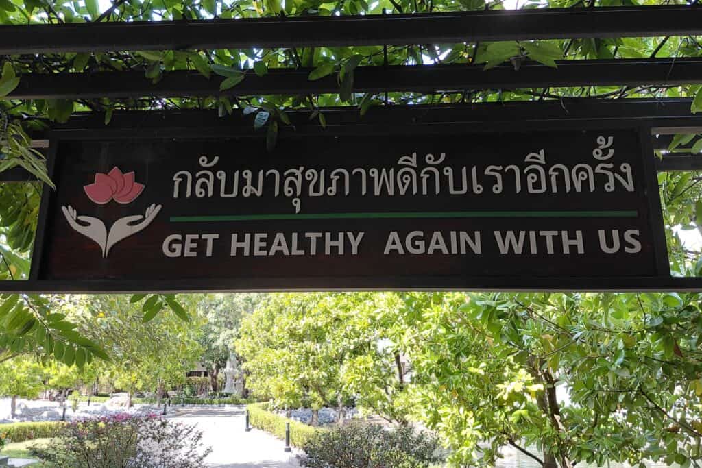 Medical wellness image featuring a serene spa setting with white towels, a calla lily, glowing candles, and natural soft lighting, symbolizing holistic health, preventive wellness programs, relaxation therapy, and medical wellness treatments offered through professional wellness medical centers and medical spa resorts.