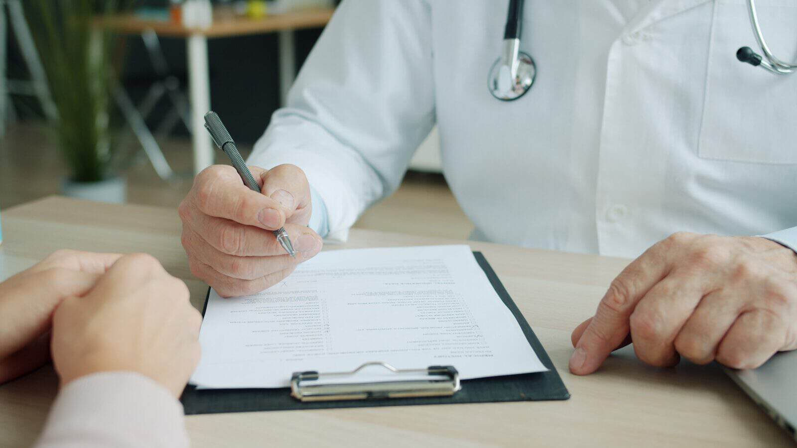 Medical form, passport and health documents prepared before surgery in Thailand