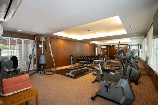 Fitness room with cardio machines, weights and space for independent exercise