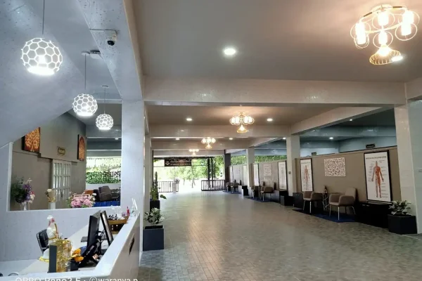 Modern medical clinic reception area in Bangkok, featuring seating, decor, and patient check-in desks - Treatment room Sanpudard Wellness Club
